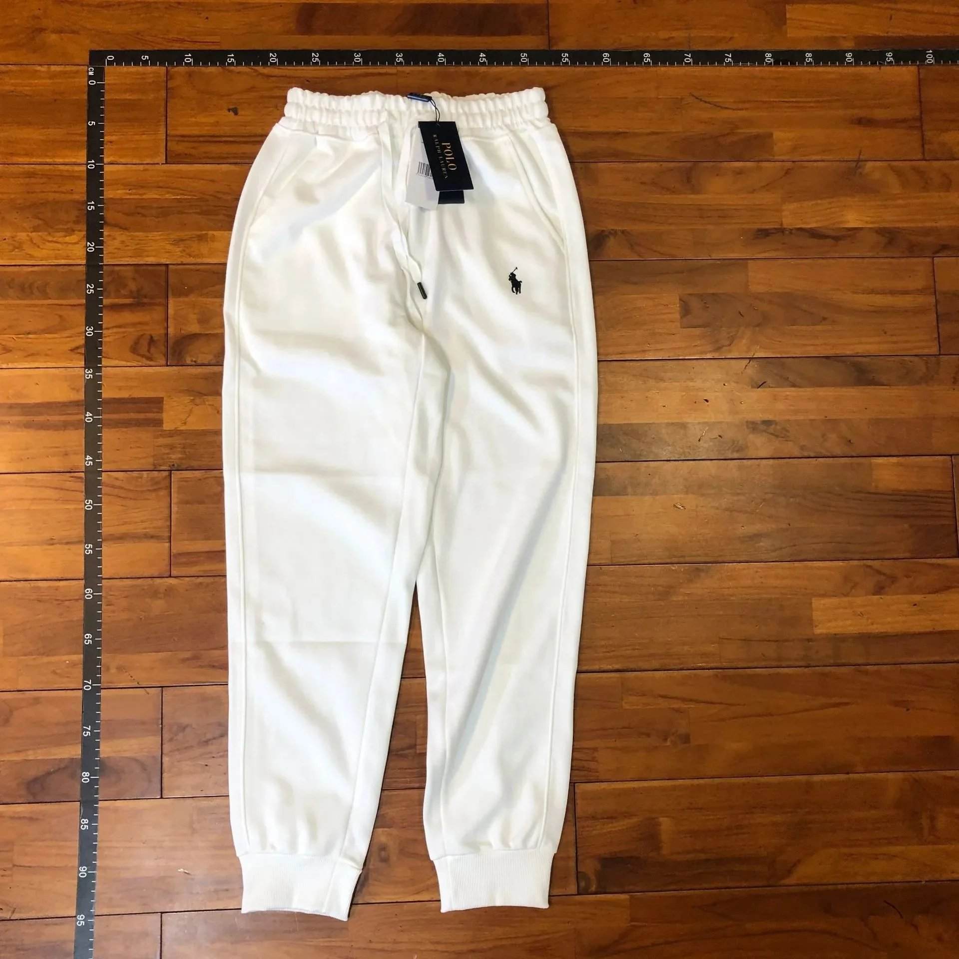 Real shot of white black label pants